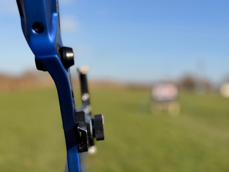Archer drawing a bow on an outdoor range